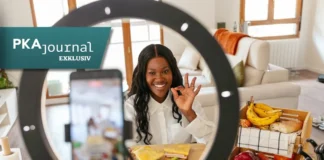 Frau filmt Essen mit dem Smartphone für Social Media